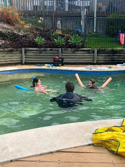 Outdoor lesson in progress with pool toys